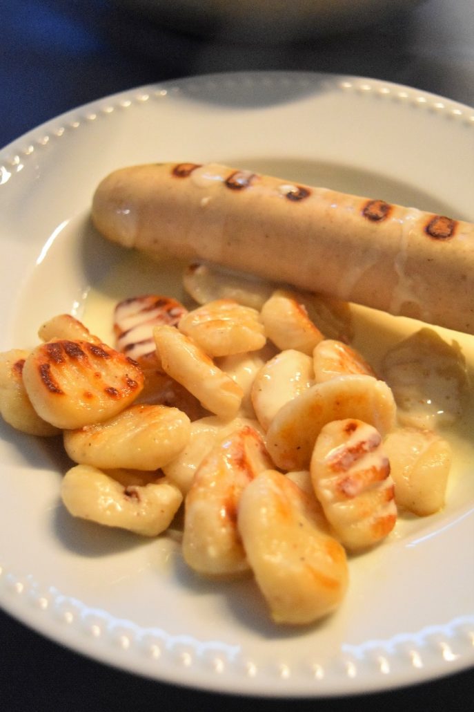 Gnocchi à la ricotta, sauce maroilles et saucisse